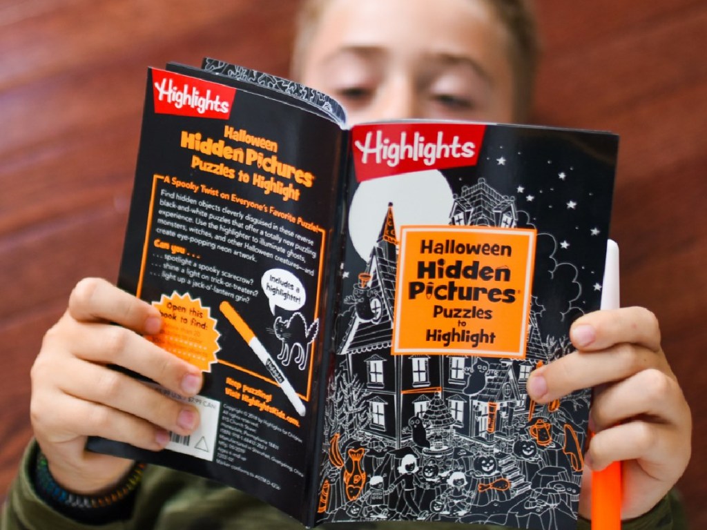 boy reading Highlights hidden pictures