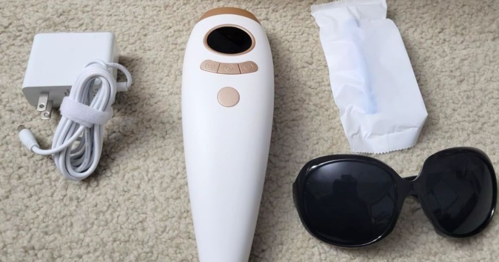 Aopvui IPL Hair Removal Device shown with glasses, charger cable and instruction papera