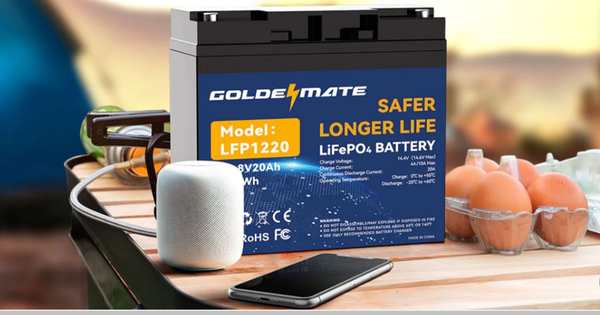 Goldenmate Lithium Battery shown on table at campground charging devicees