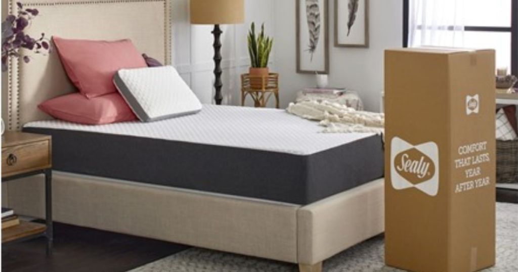 Sealy Memory Foam Mattress with CopperChill Technology shown on a bedframe with the mattress box in a bedroom