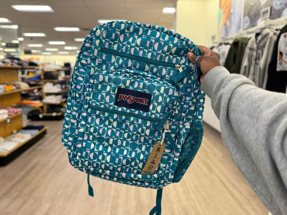 JanSport Big Student Backpack in Blocky in hand in store