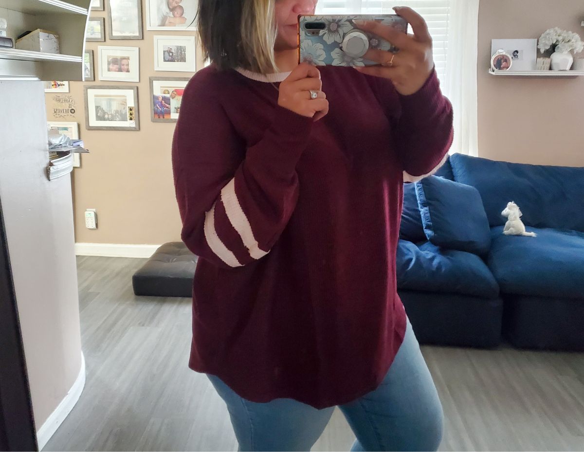 a woman taking a selfie wearing a Juniors' Plus SO Cozy Striped Sleeve Tunic Tee