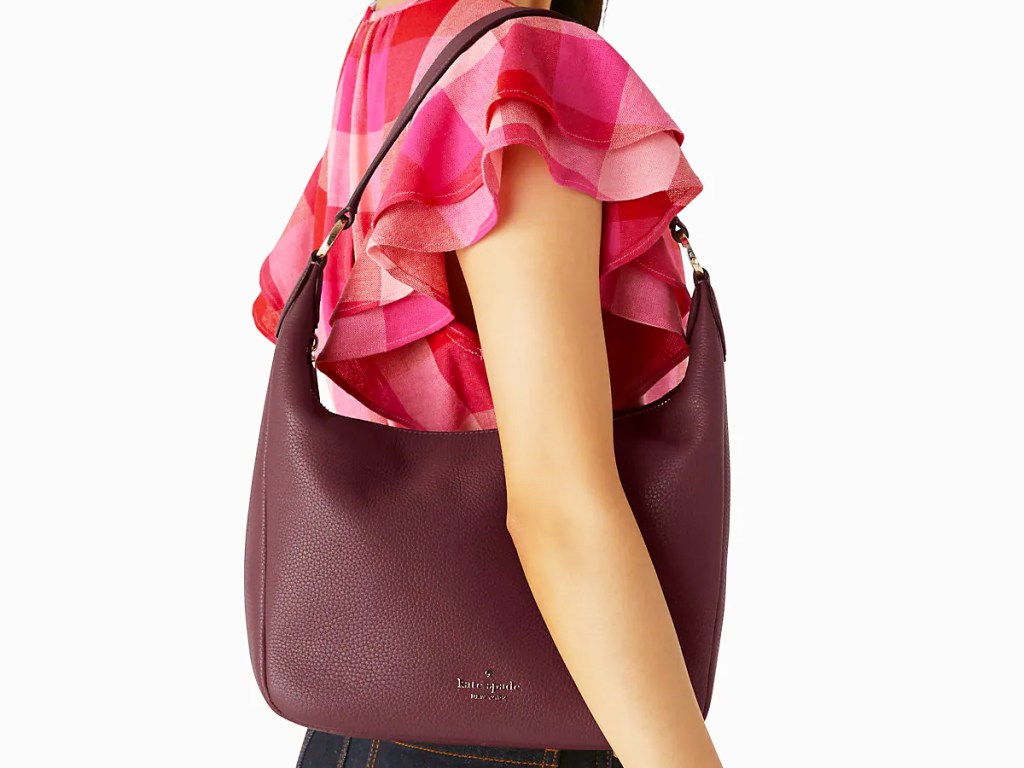 woman with a maroon shoulder bag