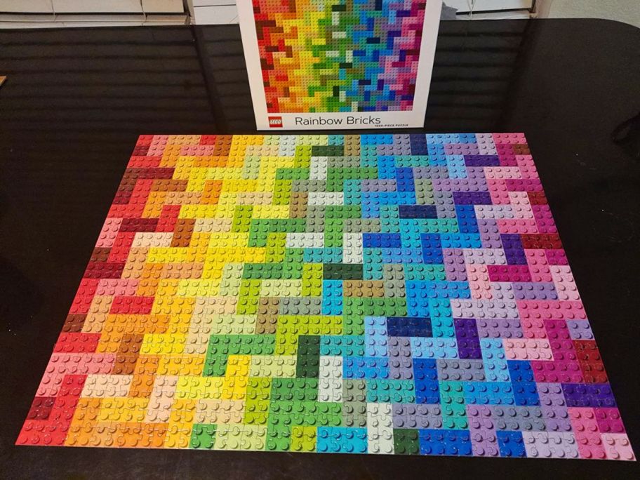 lego rainbow bricks 1000 piece puzzle assembled on a dining table and shown with box