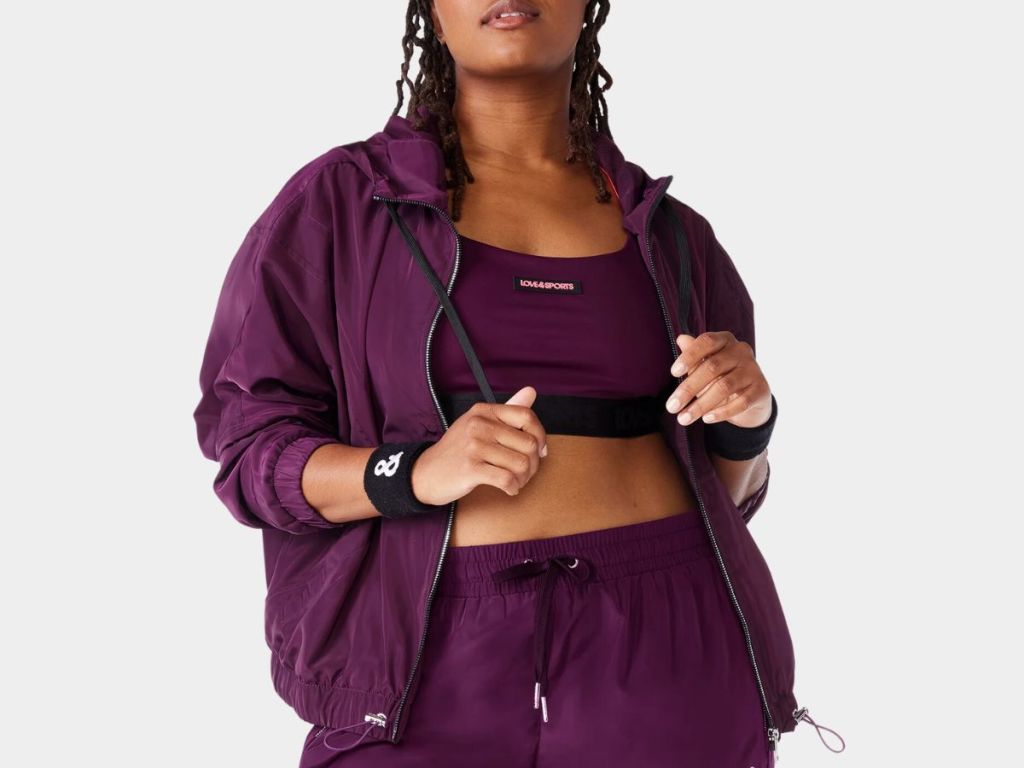 woman wearing a purple track jacket