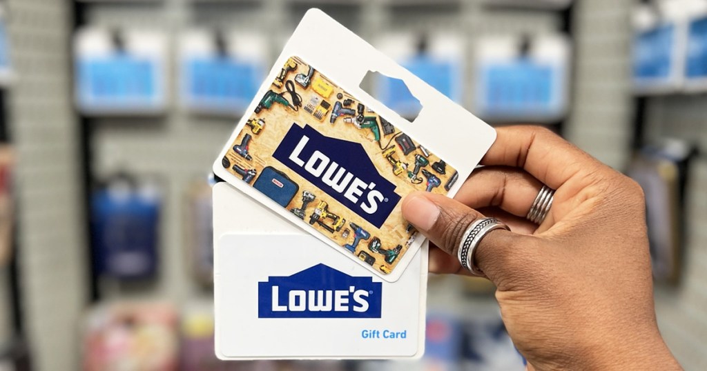hand holding up two lowe's gift cards