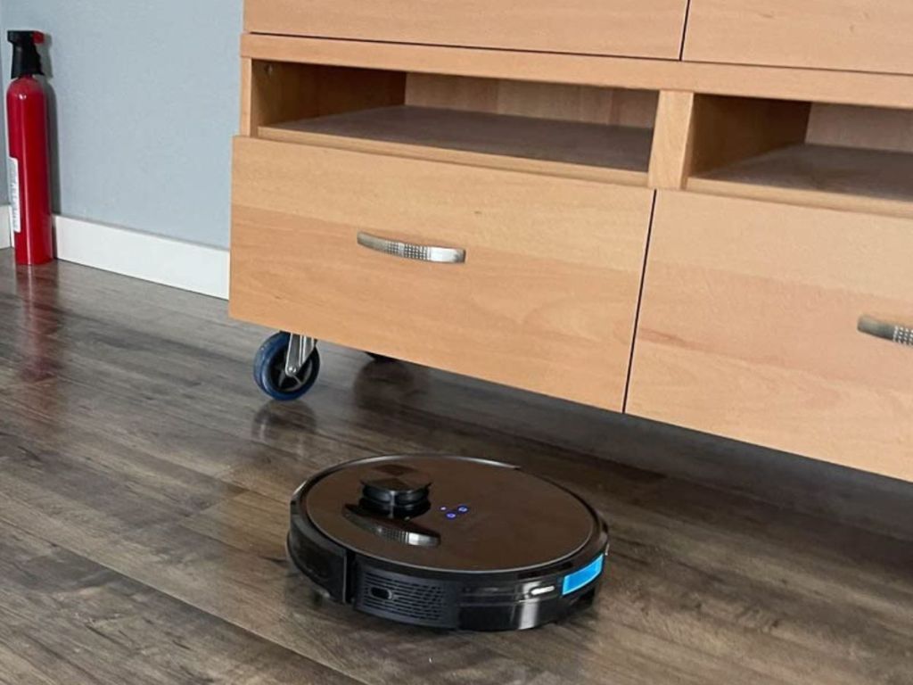 Lubluelu 2 in 1 Robotic Vacuum Cleaner about to clean under a rolling cart