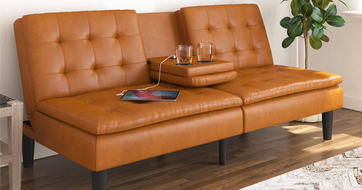 camel brown leather futon with cupcholders in center
