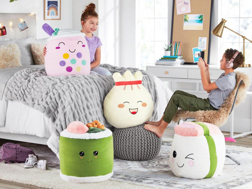 4 large food-themed squish plush toys in kids room