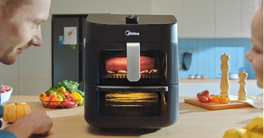 midea air fryer on counter with food cooking