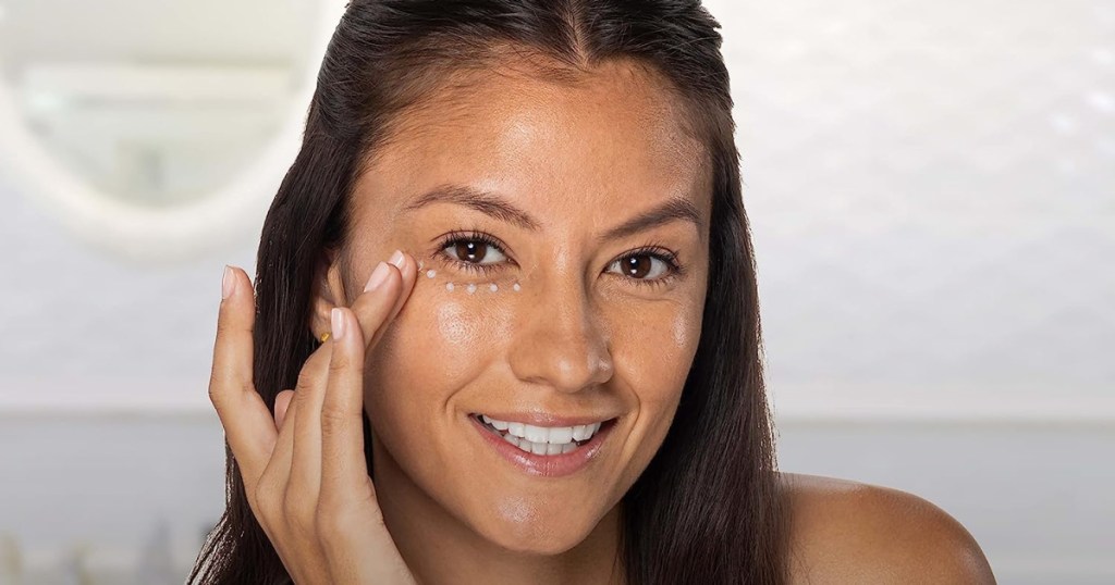 woman with Neutrogena Eye Cream dotted under her eyes