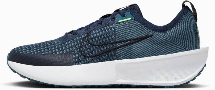 teal and white nike running shoe
