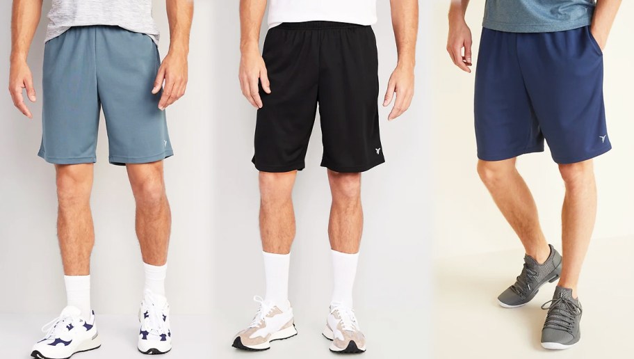 three men in blue and black athletic shorts