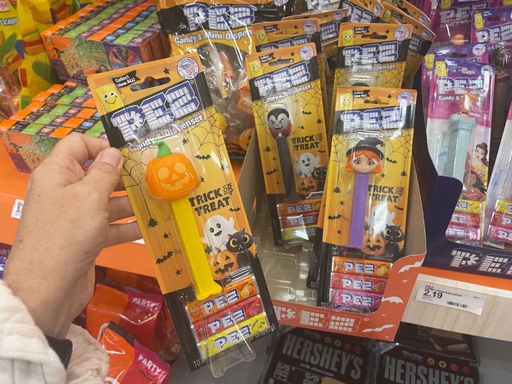 A hand holding Pez Halloween Candy Target