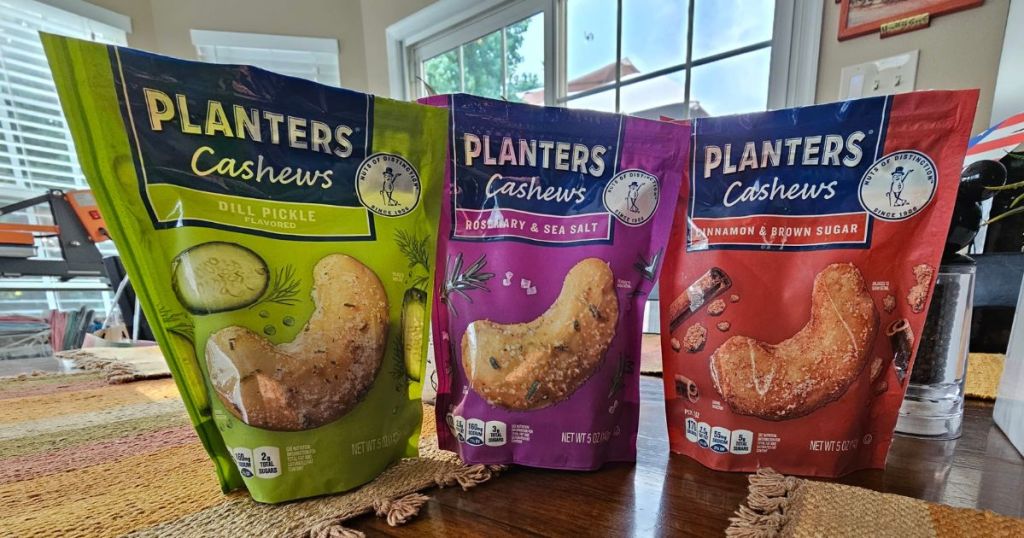 3 bags of Planters Cashews on a table 