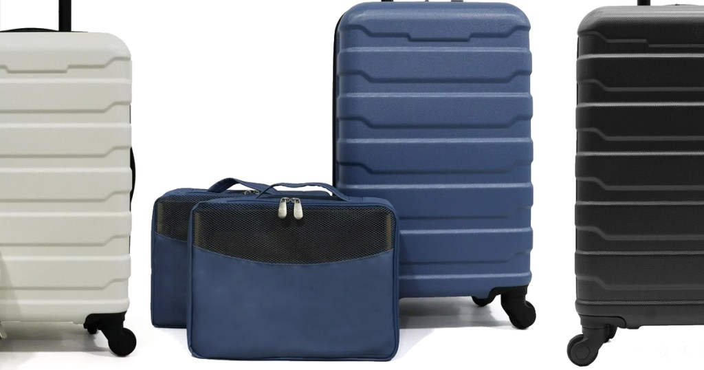 white, blue, and black hard side suit cases with set of packing cubes