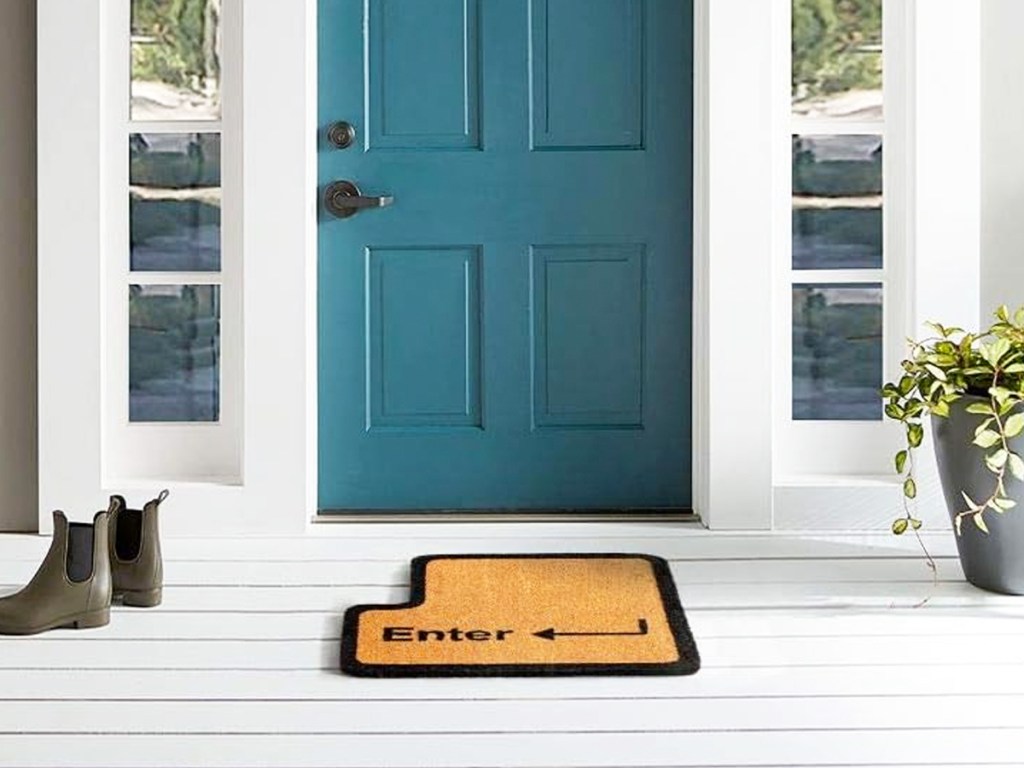 enter key shaped doormat at front door