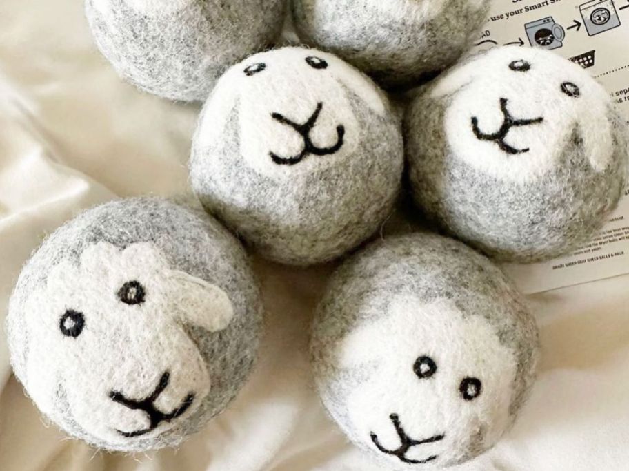 Smart Sheep Wool Dryer Balls with Smiling Shee on them