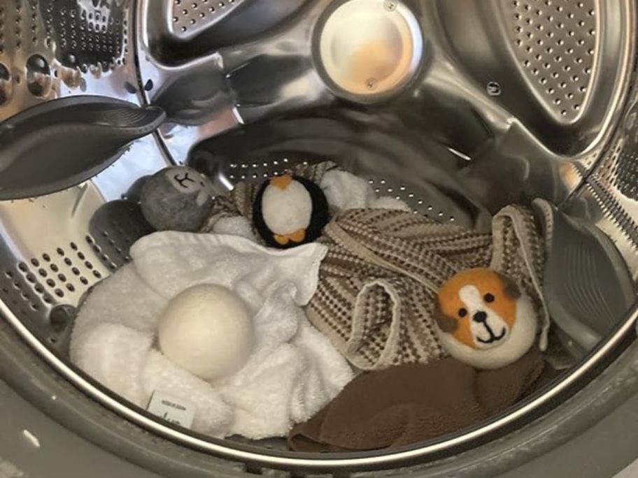 A dryer with towels and Smart Sheep wool dryer balls