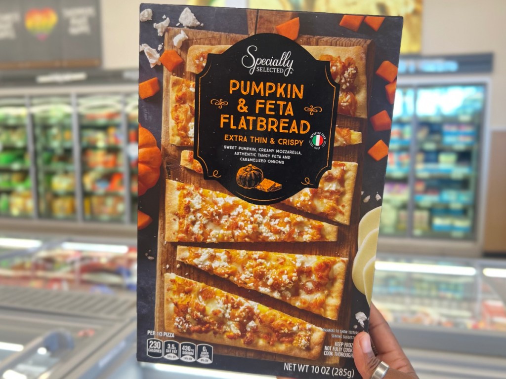 Specially Selected Pumpkin Feta and Beetroot Goat Cheese Flatbread hand holding
