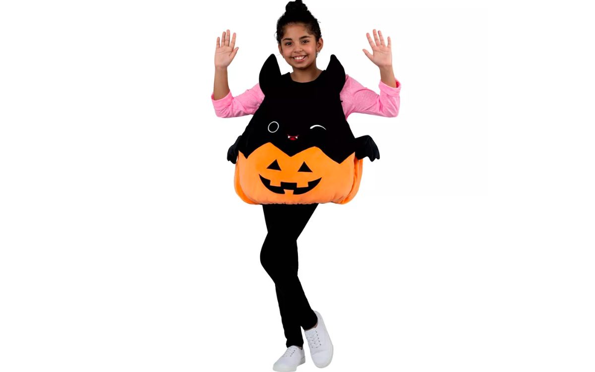 a little girl wearing a Squishmallow Emily the Bat Halloween Costume Vest