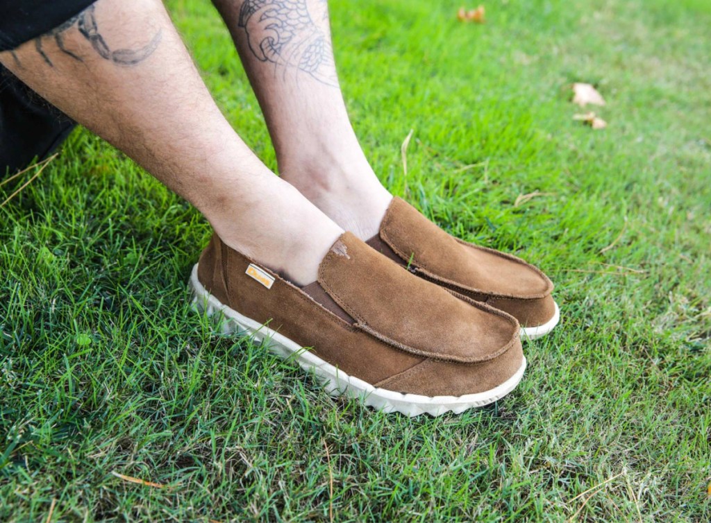 man wearing a pair of Suede Hey Dude shoes