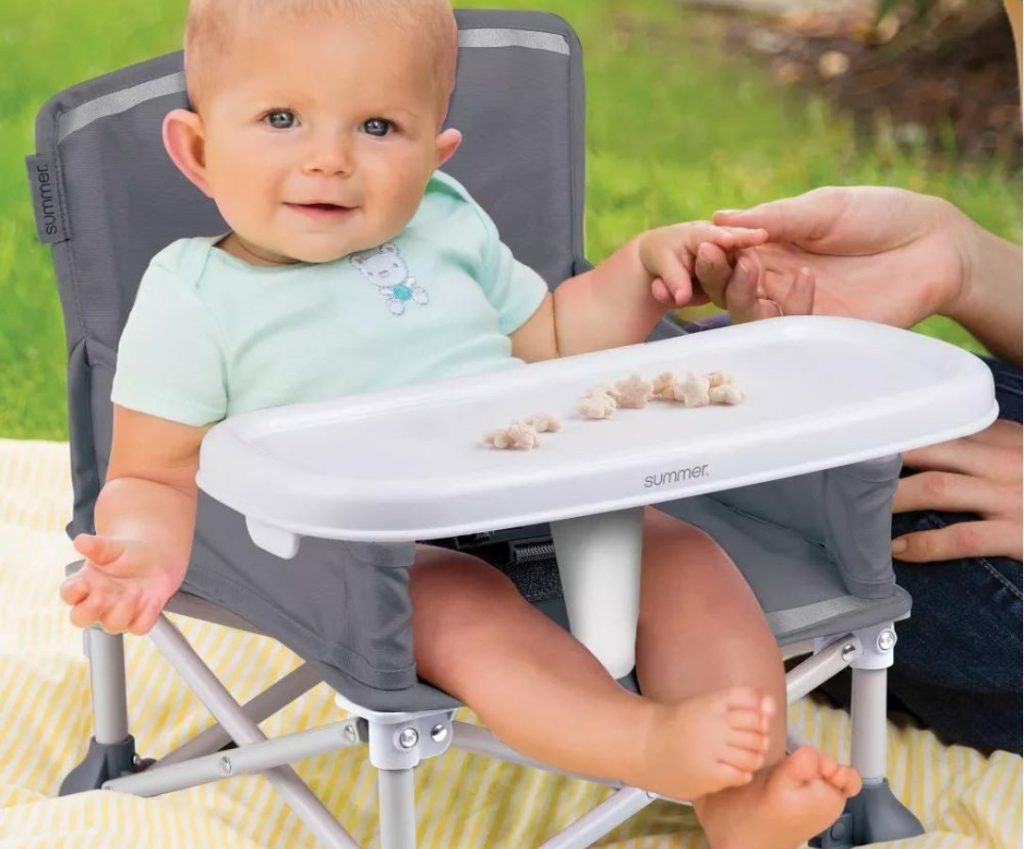 Baby sitting in Summer Infant Pop N Sit Seat