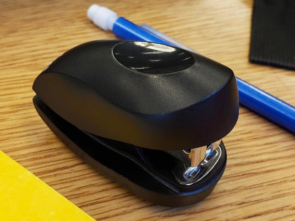swingline mini stapler next to a pencil