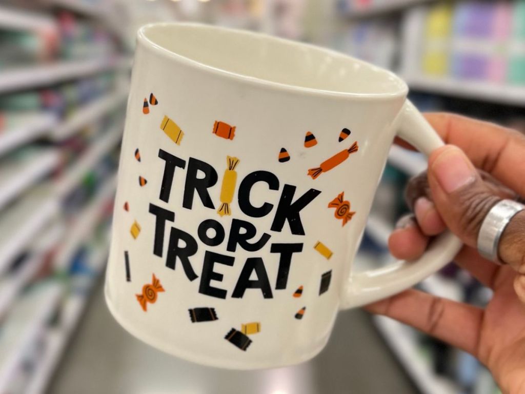 Hand holding a Hallowen mug at Target