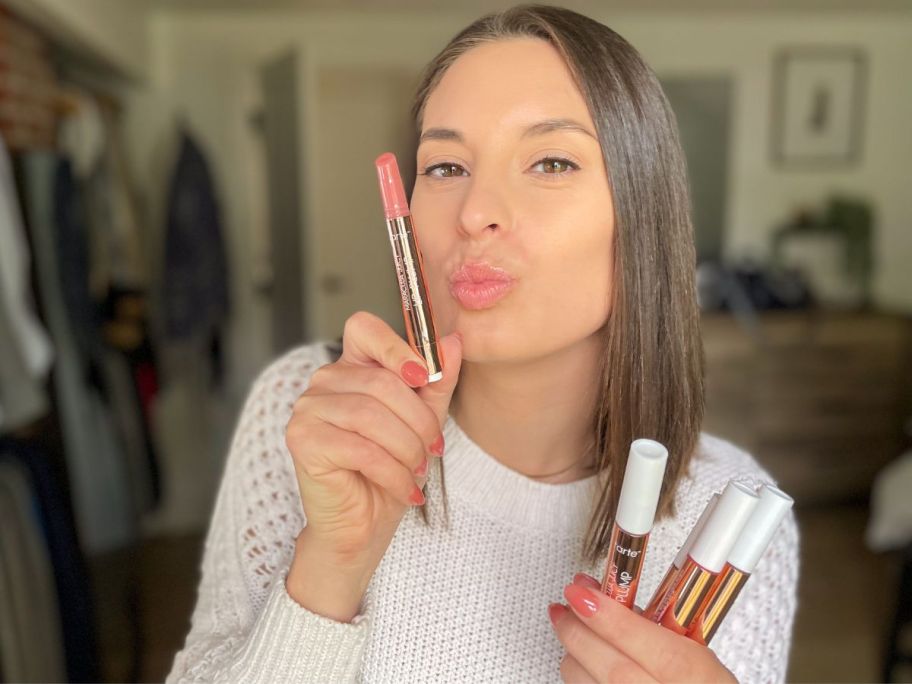 Emily holding a Tarte Maracuja Juicy Lip 5-Piece Set