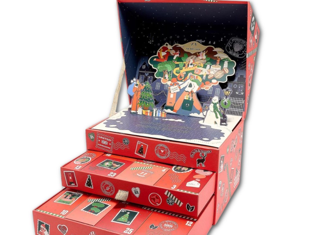 The body shop advent calendar opened to expose pop up holiday designs and drawers with boxes of beauty products