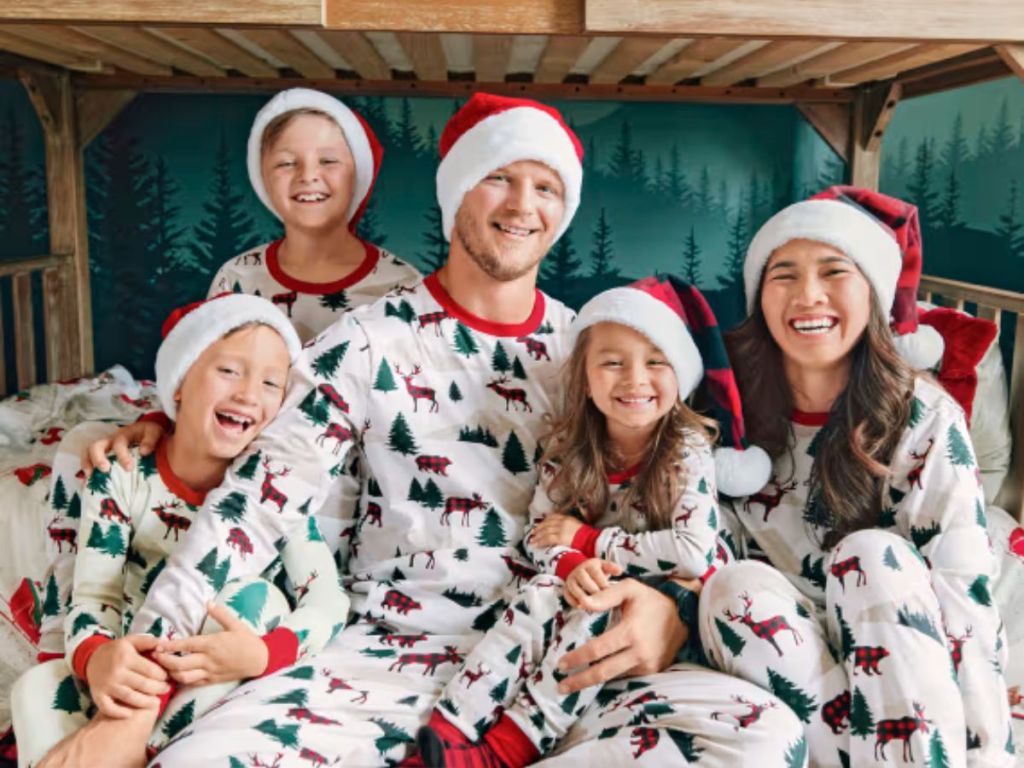 family wearing matching christmas pajamas