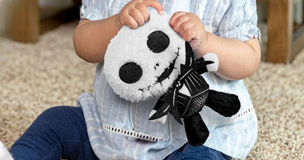 baby holding he Nightmare Before Christmas Disney Cuteeze Jack Skellington Stuffed Animal Plush Toy  