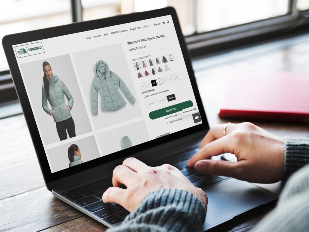 Woman browsing The North Face Renewed website