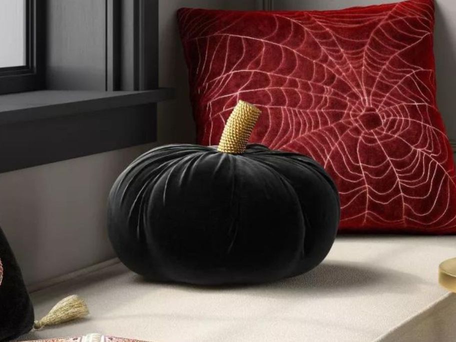 Threshold Shaped Velvet Black Pumpkin Pillow on bench