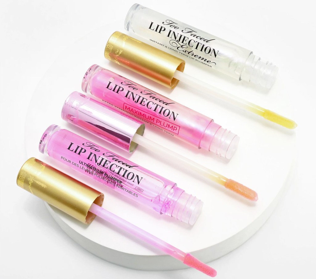 three tubes of Too Faced Lip Injection Plumping Gloss