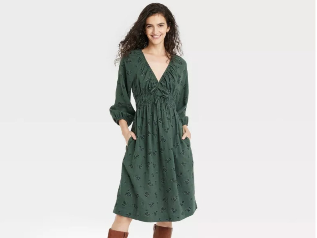 woman in green v neck dress