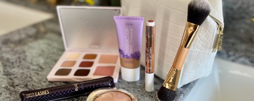 Tarte cosmetics makeup items and tan color makeup bag