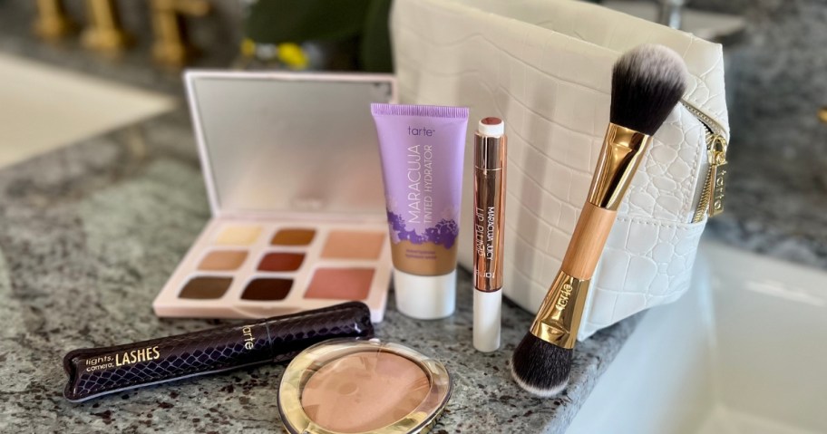 Tarte cosmetics makeup items and tan color makeup bag