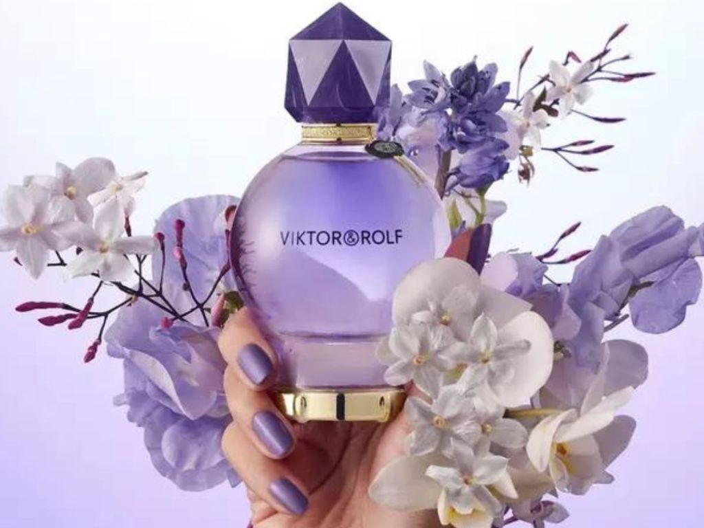 Hand holding a bottle of Viktor&Rolf Good Fortune Perfume