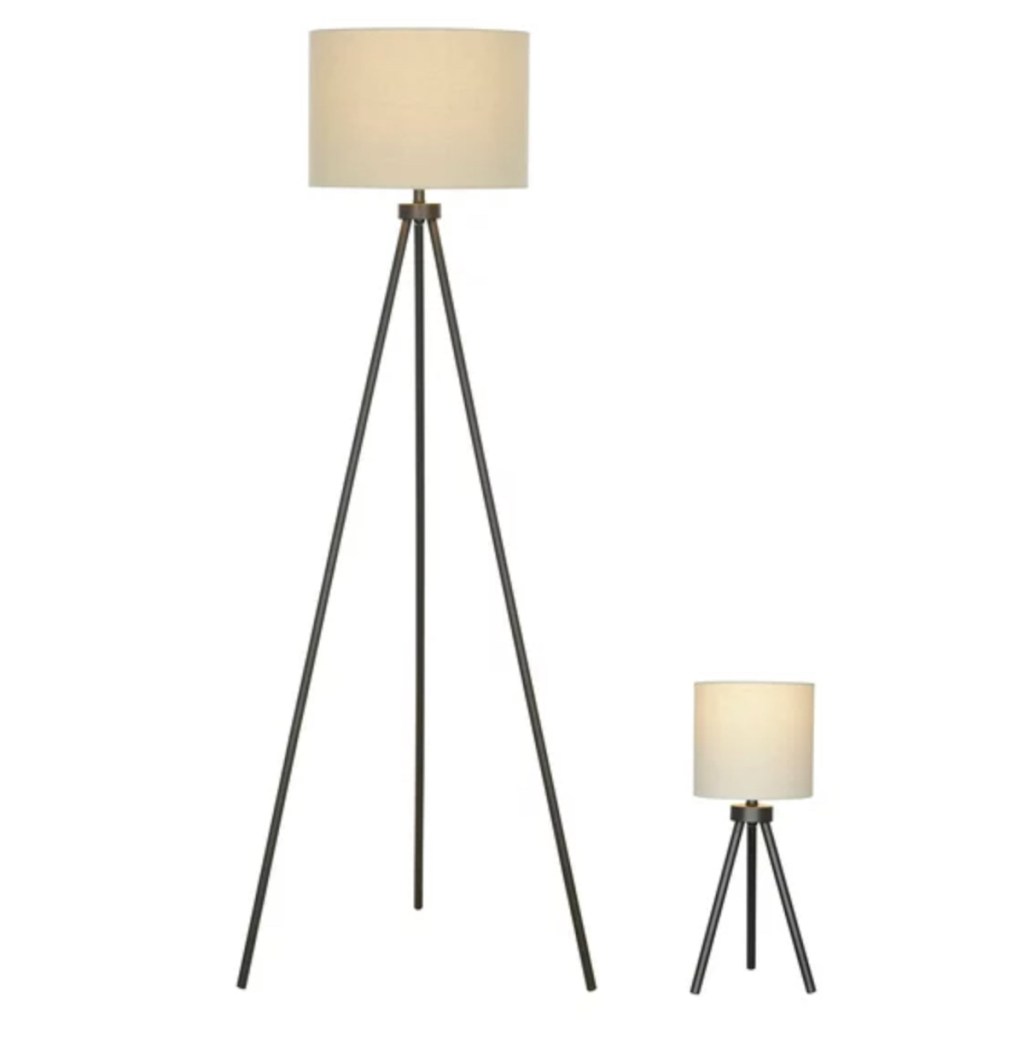 stock photo of two tripod floor lamps 