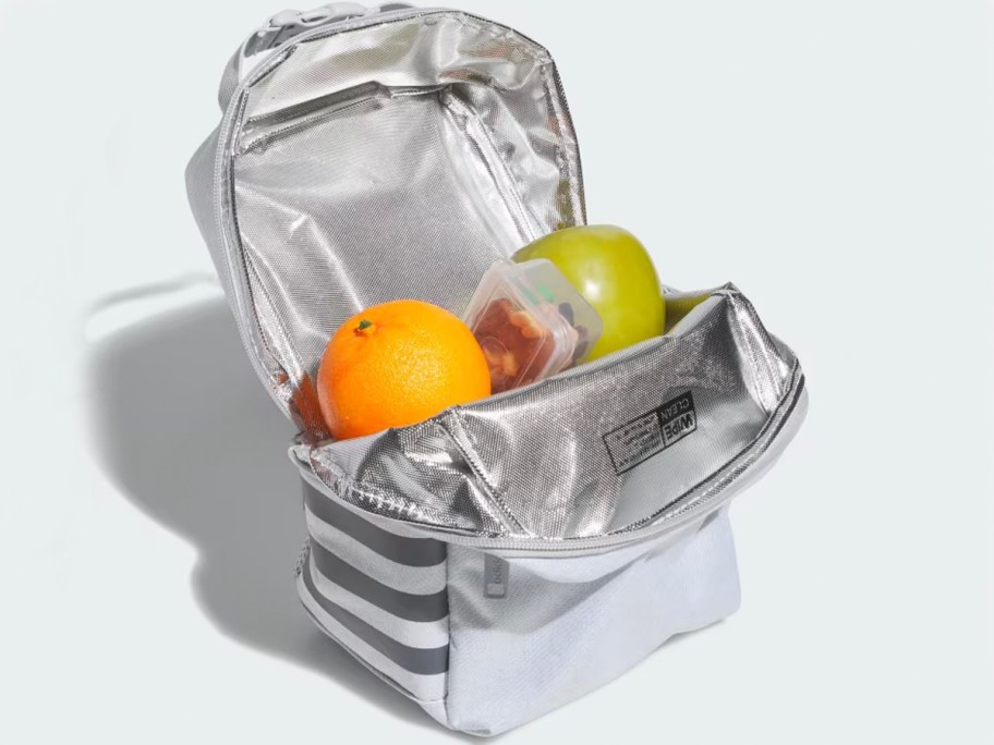 white adidas lunchbag open with fruit inside 