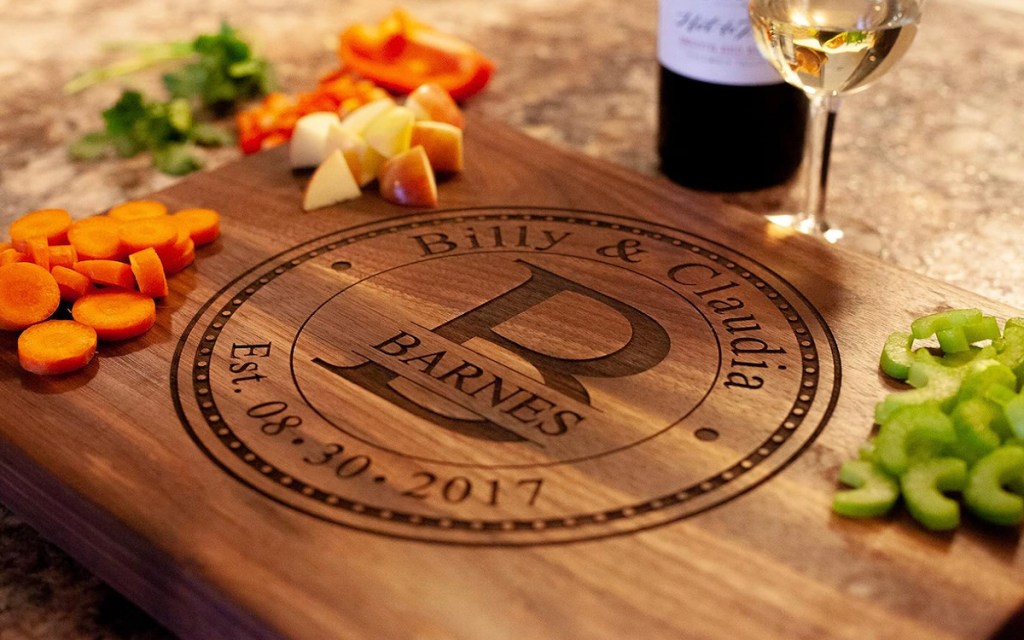 close up of personalized cutting board with diced vegetables on top