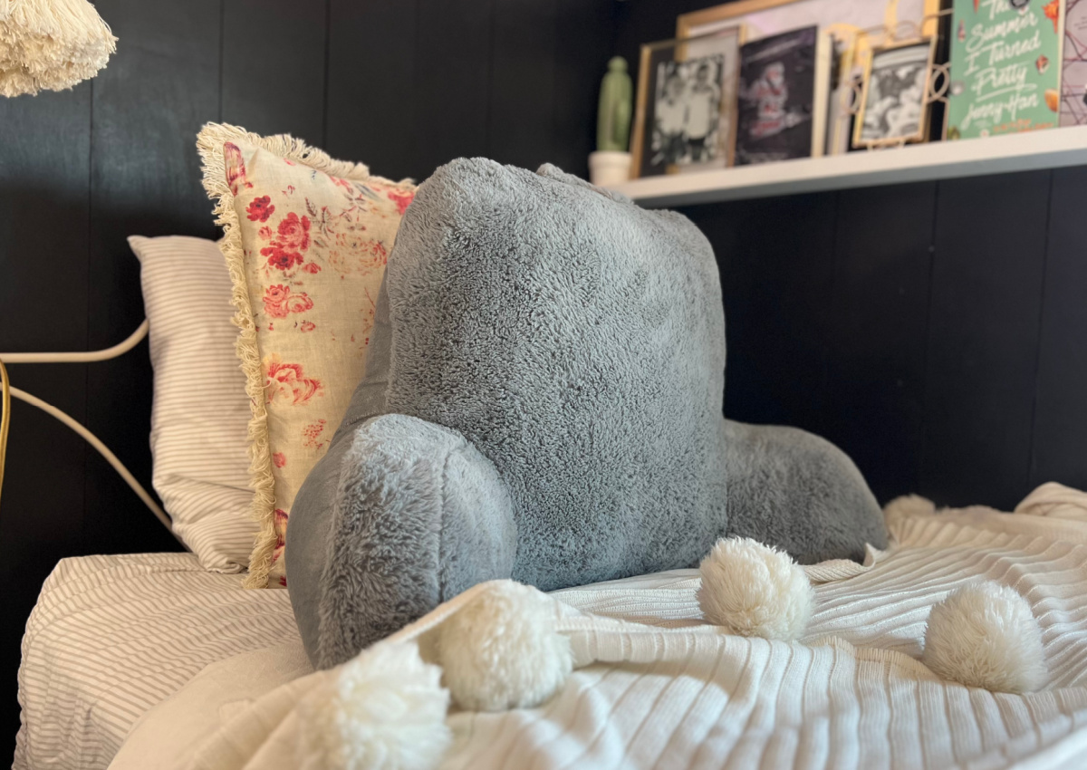 grey backrest pillow in dorm room