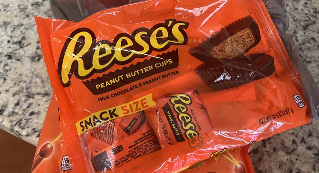 bag of halloween Reeses snack size candy laid out on table with Walgreens bag underneath