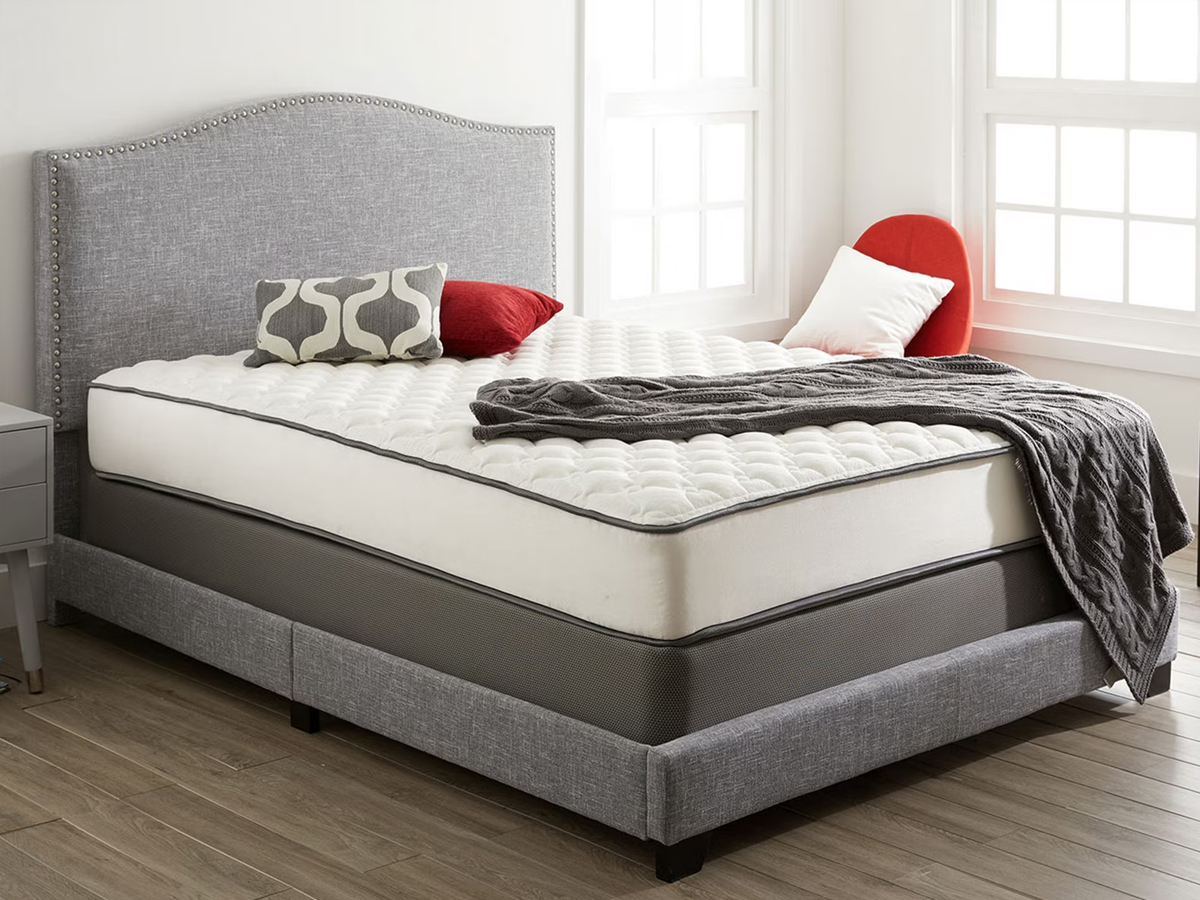 mattress on gray bedframe in bedroom