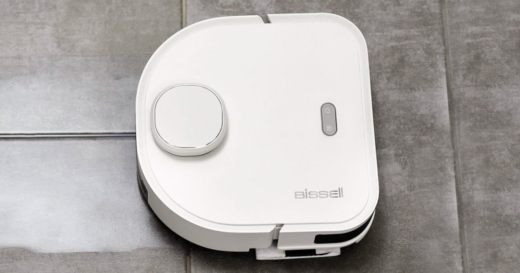 white bissel robotic mop cleaning tile