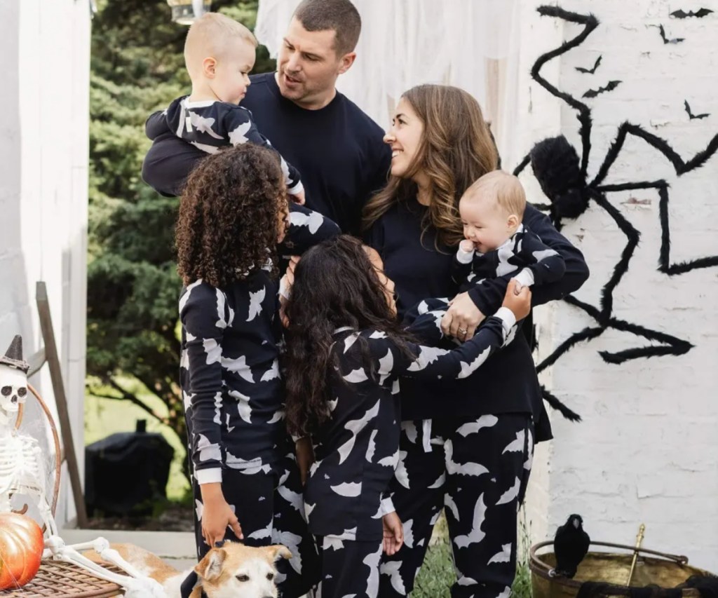 family in matching bats pajamas