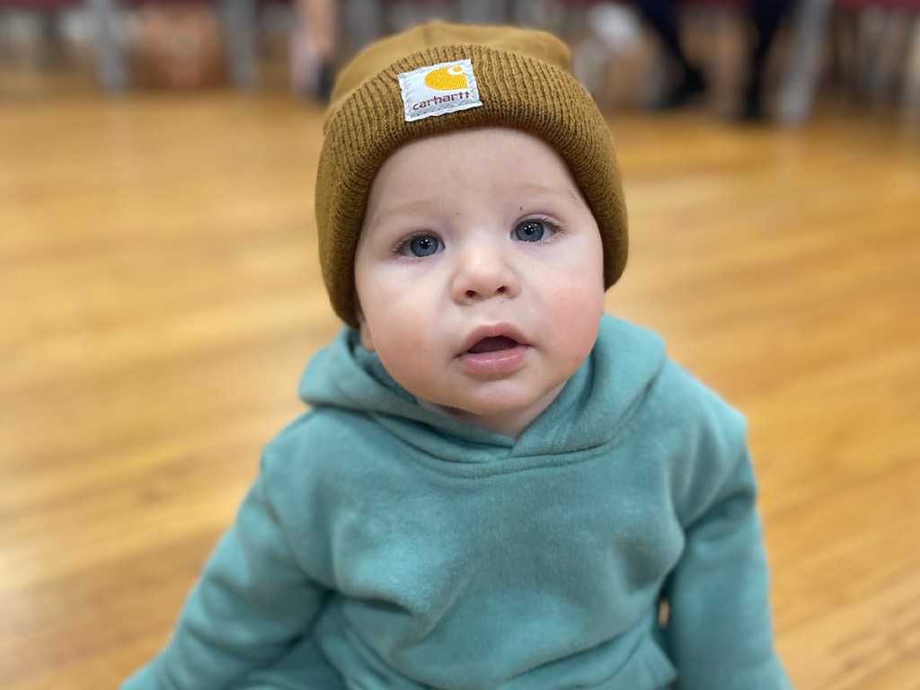baby wearing carhartt beanie