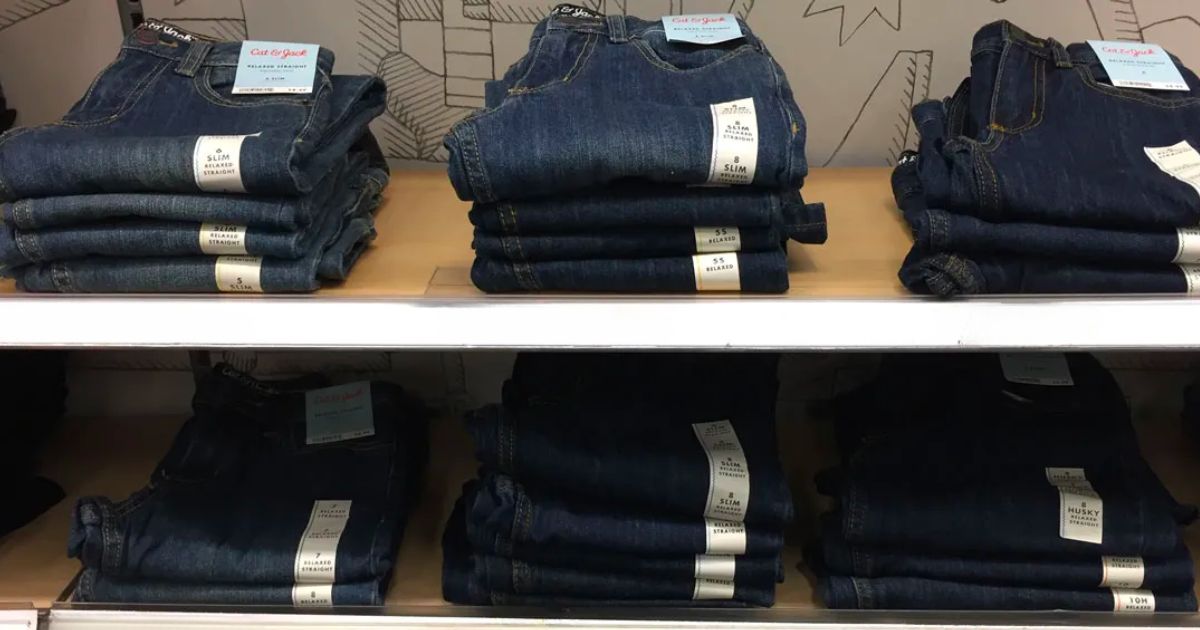 pairs of cat and jack boys jeans on shelves in a Target store